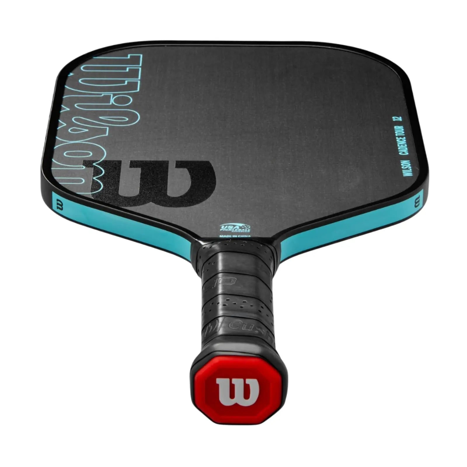 Wilson Cadence Tour 12mm pickleball paddle, black with teal trim, raw carbon surface, red butt cap.
