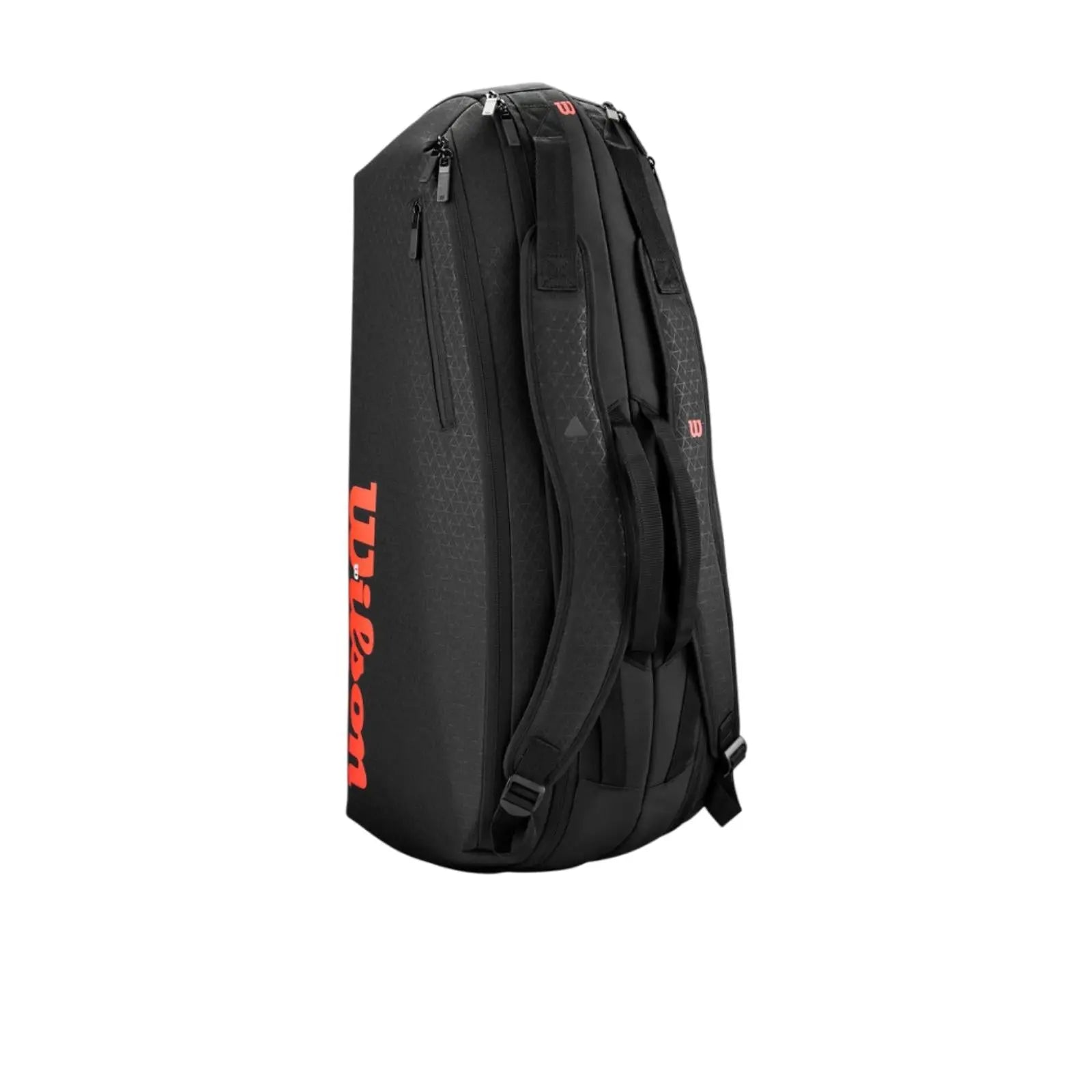 Black Wilson Super Tour Clash v3 6 Racquet tennis bag with red logo, subtle triangle pattern, and backpack straps.