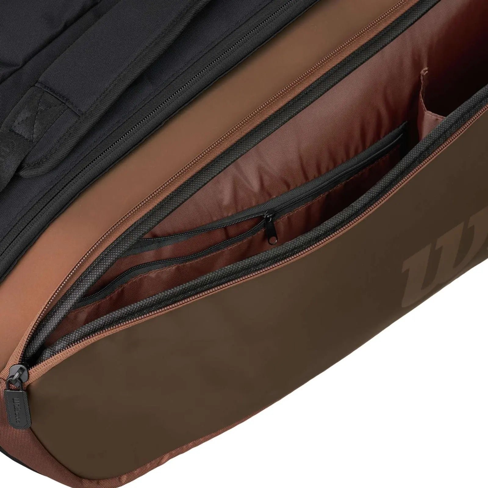 Wilson Super Tour PRO Staff 9 Racquet Tennis Bag in brown and black, showing open compartments and zippers.