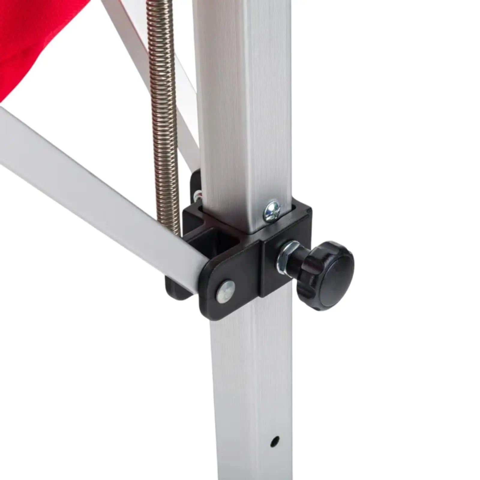 Close-up of a silver aluminum tennis ball cart frame with a black adjustment knob and spring.