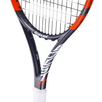 Babolat Boost Strike tennis racquet with dark grey frame, orange accents, white grip, and strung with white strings.