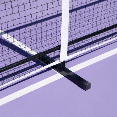 Black Luft 6.8M pickleball net with white PVC oxford cloth band on a purple court.
