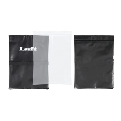 Black Luft Sand Bag for pickleball net stability, with clear inner bag and white logo.