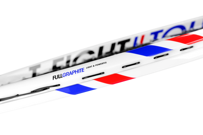 White Tecnifibre TFight 26 junior tennis racquet with red and blue stripes, "FULLGRAPHITE" text.