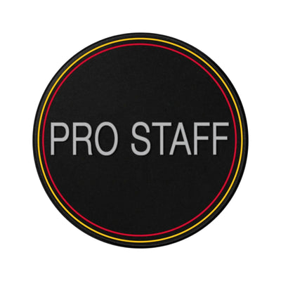 Black oval Wilson Pro Staff dampener with red and yellow trim, "PRO STAFF" in white text.