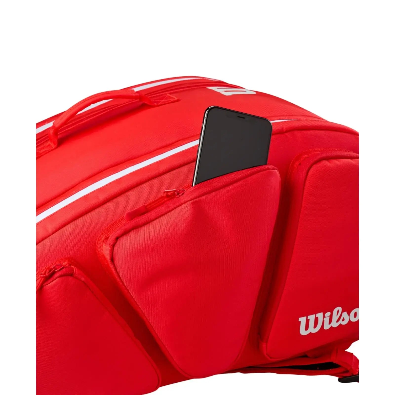 Red Wilson Super Tour pickleball bag with a phone in an outer zippered pocket.