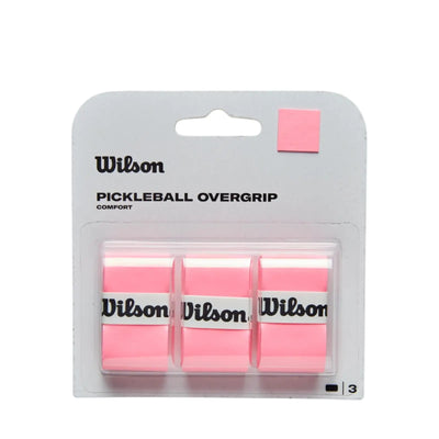 Pack of 3 pink Wilson pickleball overgrips in clear plastic packaging, with a pink color swatch.