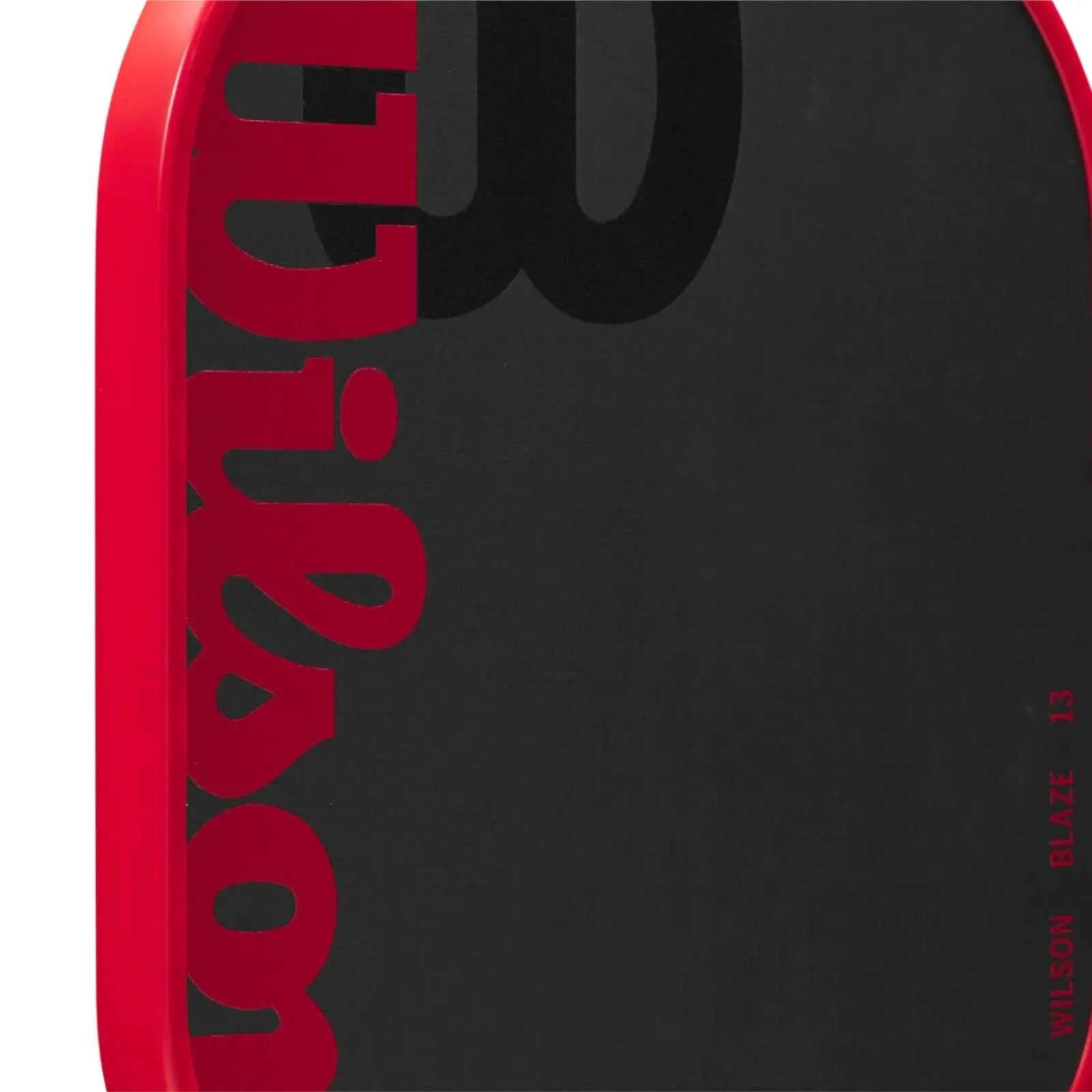 Close-up of a black Wilson Blaze 13 pickleball paddle with red trim and logo.