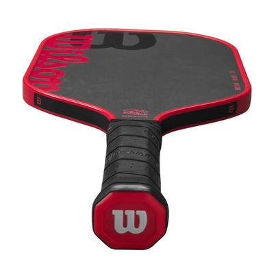 Wilson Blaze 13mm pickleball paddle, black face with red trim and handle, featuring a black grip.