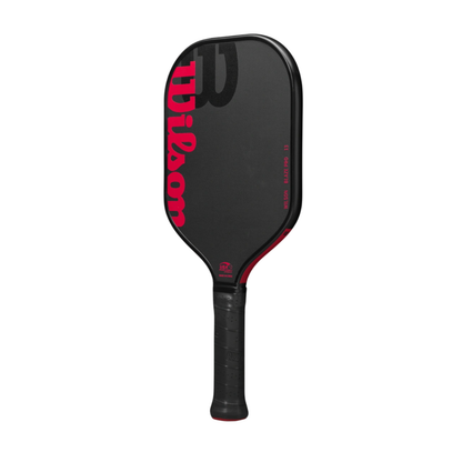 Black Wilson Blaze Pro 13 pickleball paddle with red Wilson logo and text, elongated raw hybrid surface.