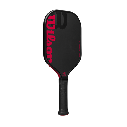 Black Wilson Blaze PRO 13mm pickleball paddle with red Wilson logo and text, elongated raw hybrid surface.