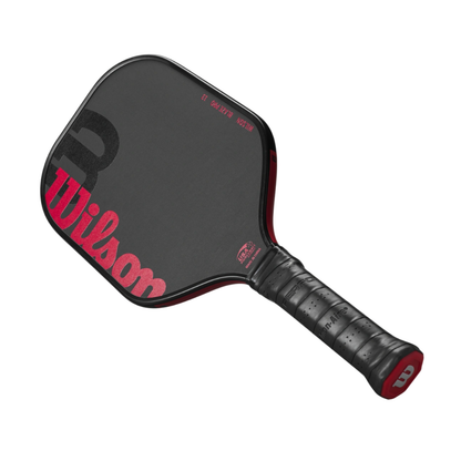 Black Wilson Blaze Pro 13 pickleball paddle with red logo, elongated raw hybrid surface, and thermoformed edge.