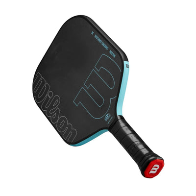 Black Wilson Cadence Edgeless 16 pickleball paddle with light blue accents and a red butt cap.