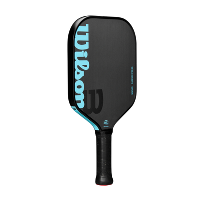 Black Wilson Cadence Pro 16 pickleball paddle with light blue "Wilson" logo and raw carbon fiber face.