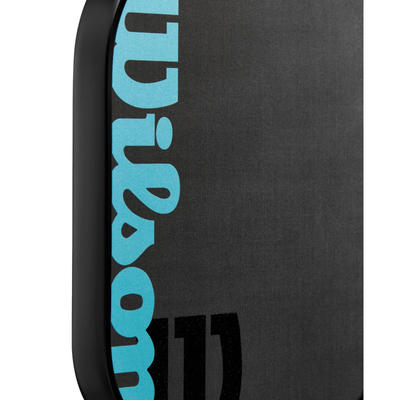 Close-up of the black Wilson Cadence Pro 16mm pickleball paddle with blue Wilson logo.