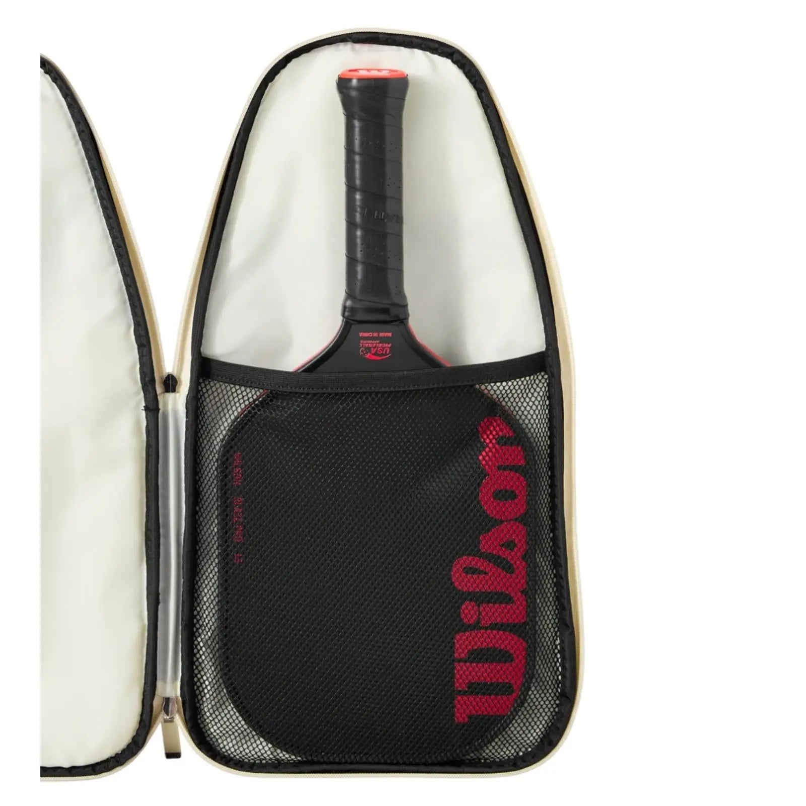 Tan Wilson pickleball paddle full cover, open to show a black paddle with red Wilson logo and a mesh accessory pocket.