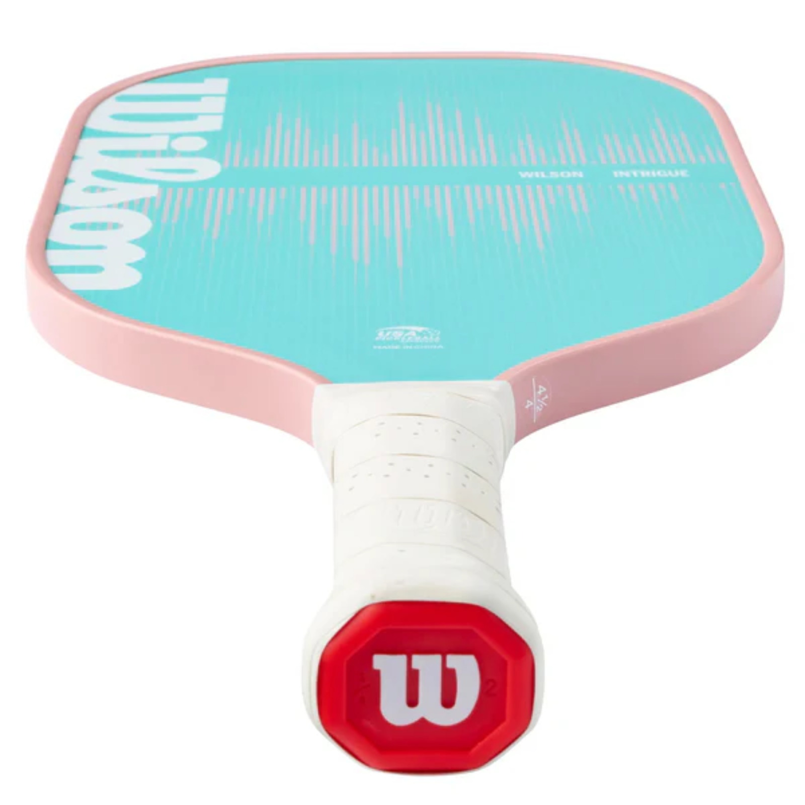 Pink and teal Wilson Intrigue pickleball paddle with a white grip and red W logo.