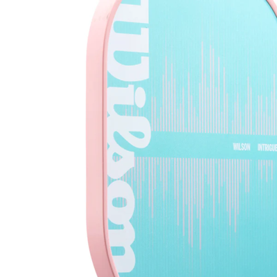 Wilson Intrigue pickleball paddle with a light blue face, white logo, and pink edgeguard.