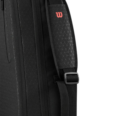 Black Wilson Super Tour Clash v3 tennis bag with subtle triangle pattern and red "W" logo on shoulder strap.