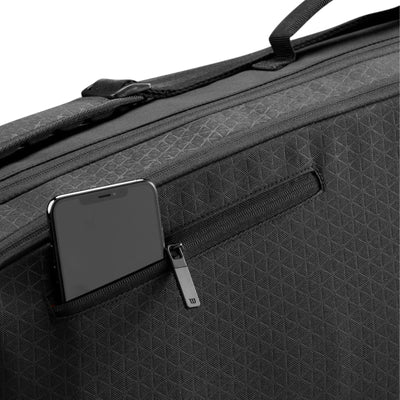 Black Wilson Super Tour Clash v3 tennis bag with subtle triangle pattern and zippered side pocket holding a smartphone.