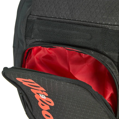 Black Wilson Super Tour Clash v3 tennis backpack with a red interior lining and red Wilson logo.