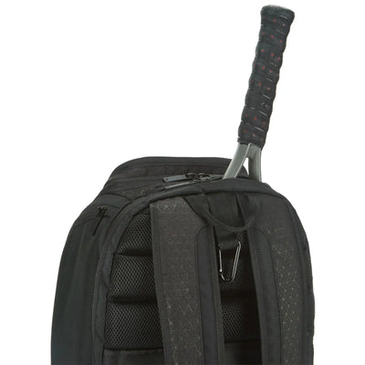 Black Wilson Super Tour Clash v3 tennis backpack with a racquet handle protruding from the top compartment.