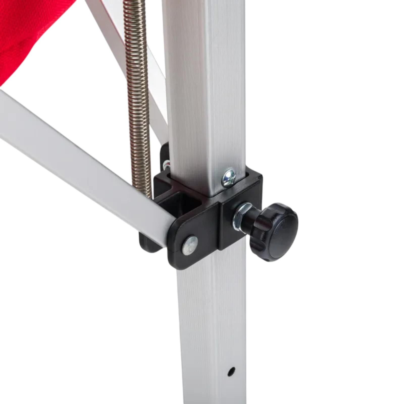 Close-up of a silver aluminum tennis ball cart frame with a black adjustment knob and spring.