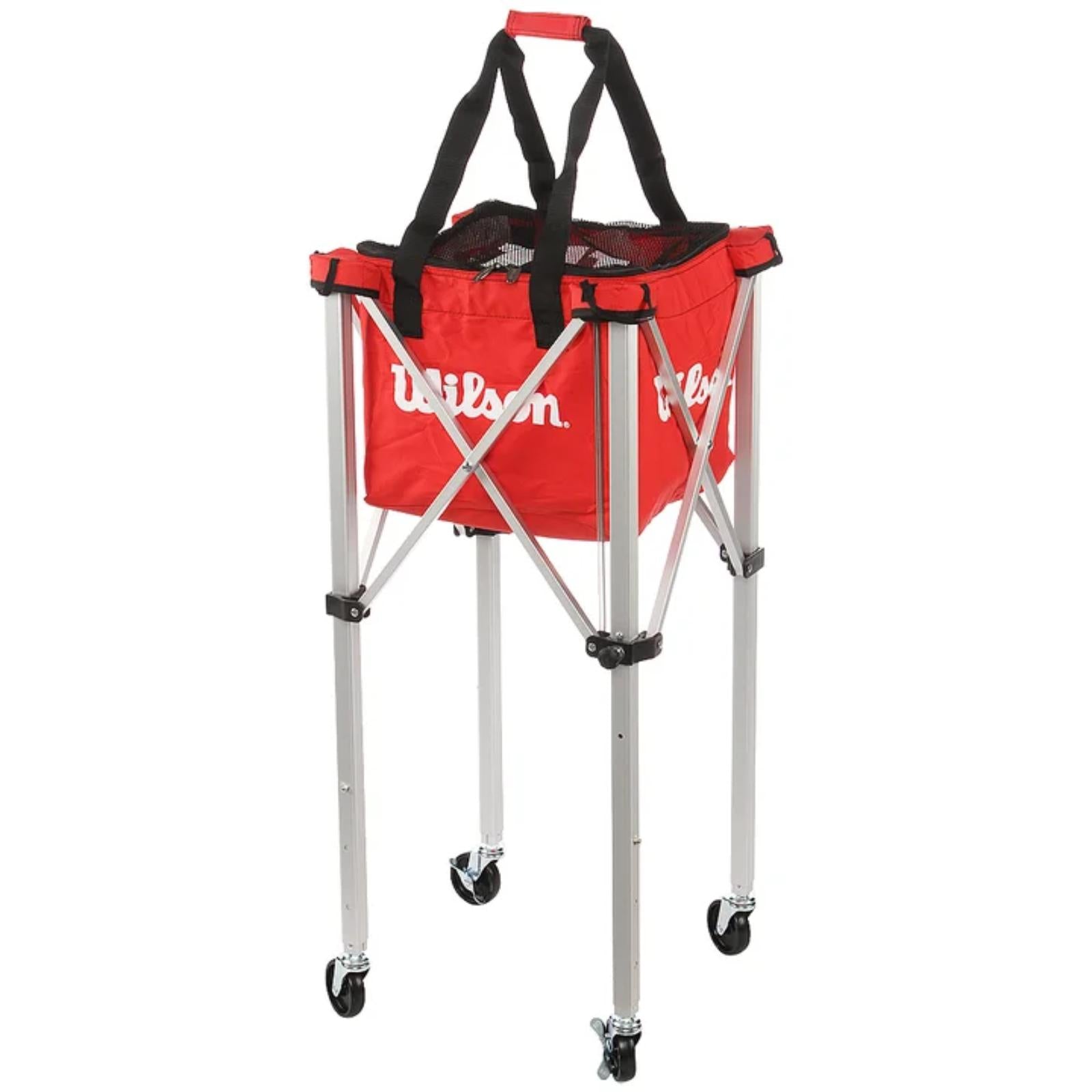 Red Wilson tennis ball teaching cart with a soft carrying case, retractable silver frame, and black wheels.