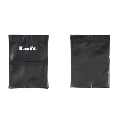 Black Luft Sand Bag for pickleball nets, durable material with white logo and securing strap.