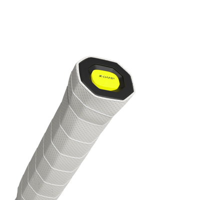 Close-up of a white Tecnifibre tennis racquet grip with a black butt cap and yellow X-DAMP logo.