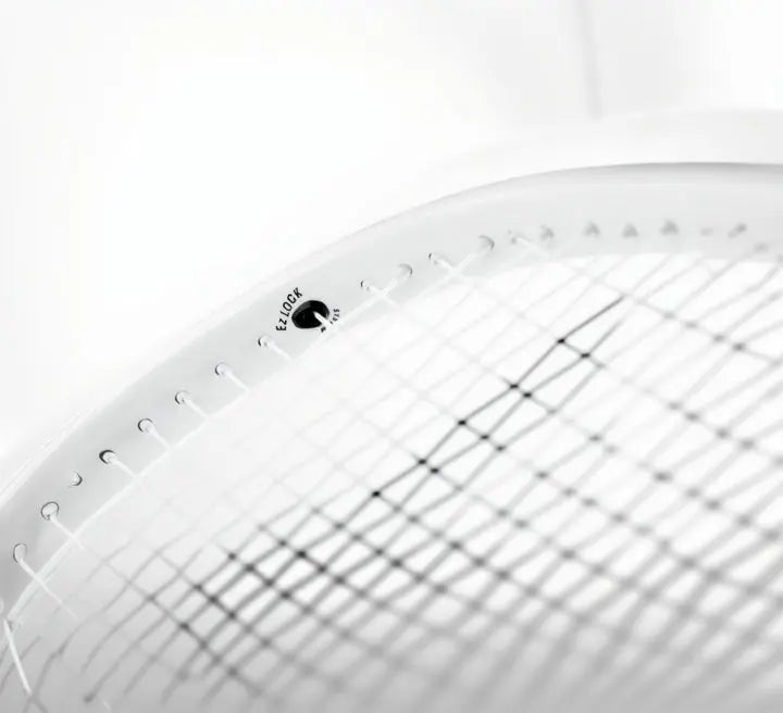 Close-up of a white Tecnifibre TFight Isoflex 285 tennis racquet frame with black strings and "EZ LOCK SYSTEM" detail.