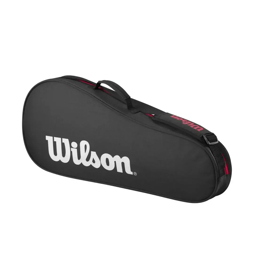Black Wilson tennis bag for 3 racquets with white logo, red accents, carry handle, and shoulder strap.