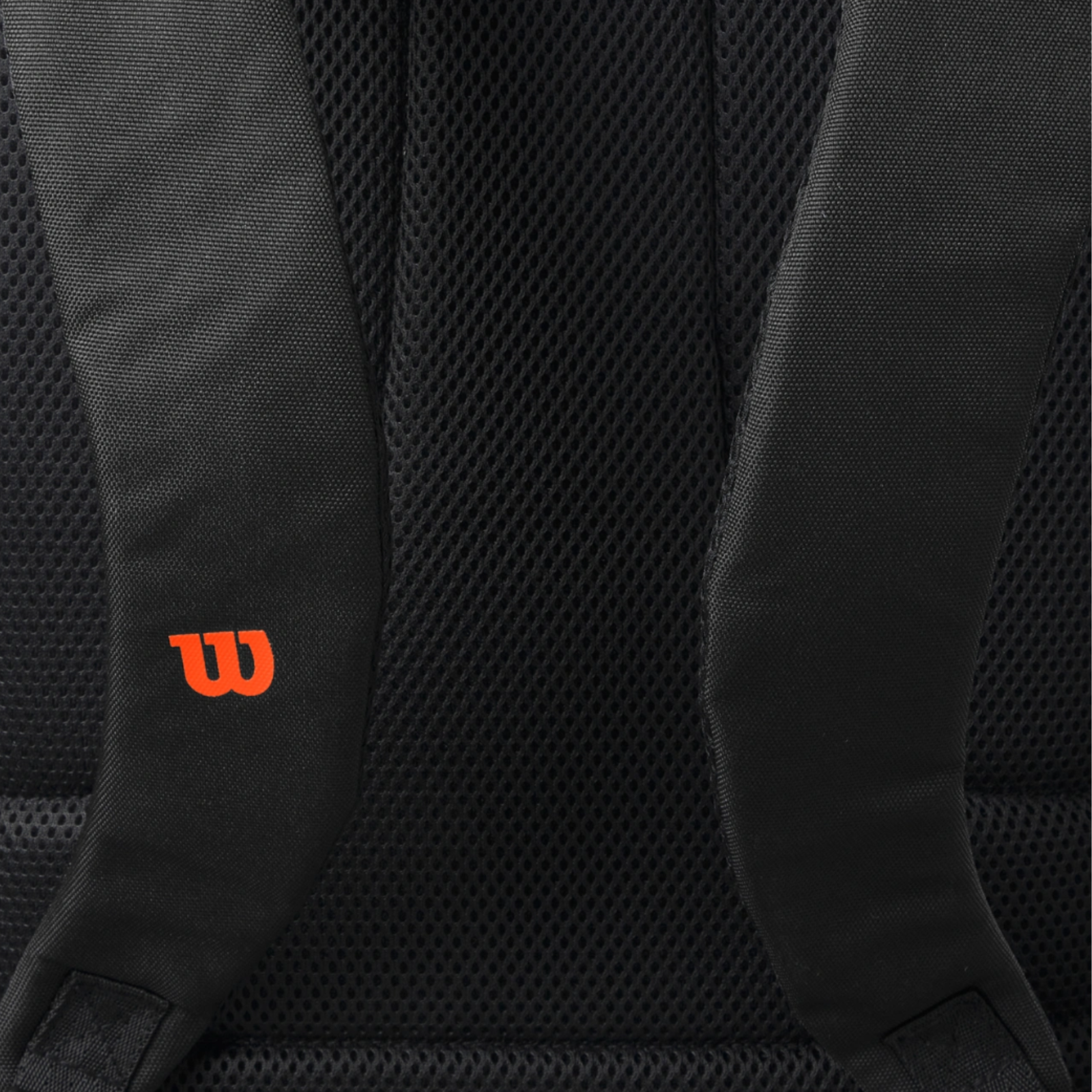 Black Wilson Blade Super Tour tennis backpack back with orange logo and mesh padding.
