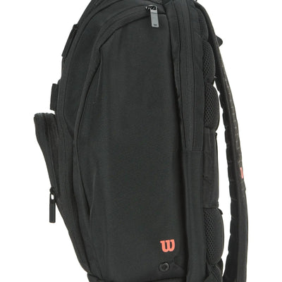 Black Wilson Super Tour Clash v3 tennis backpack with padded straps, multiple zippered compartments, and a red "W" logo.