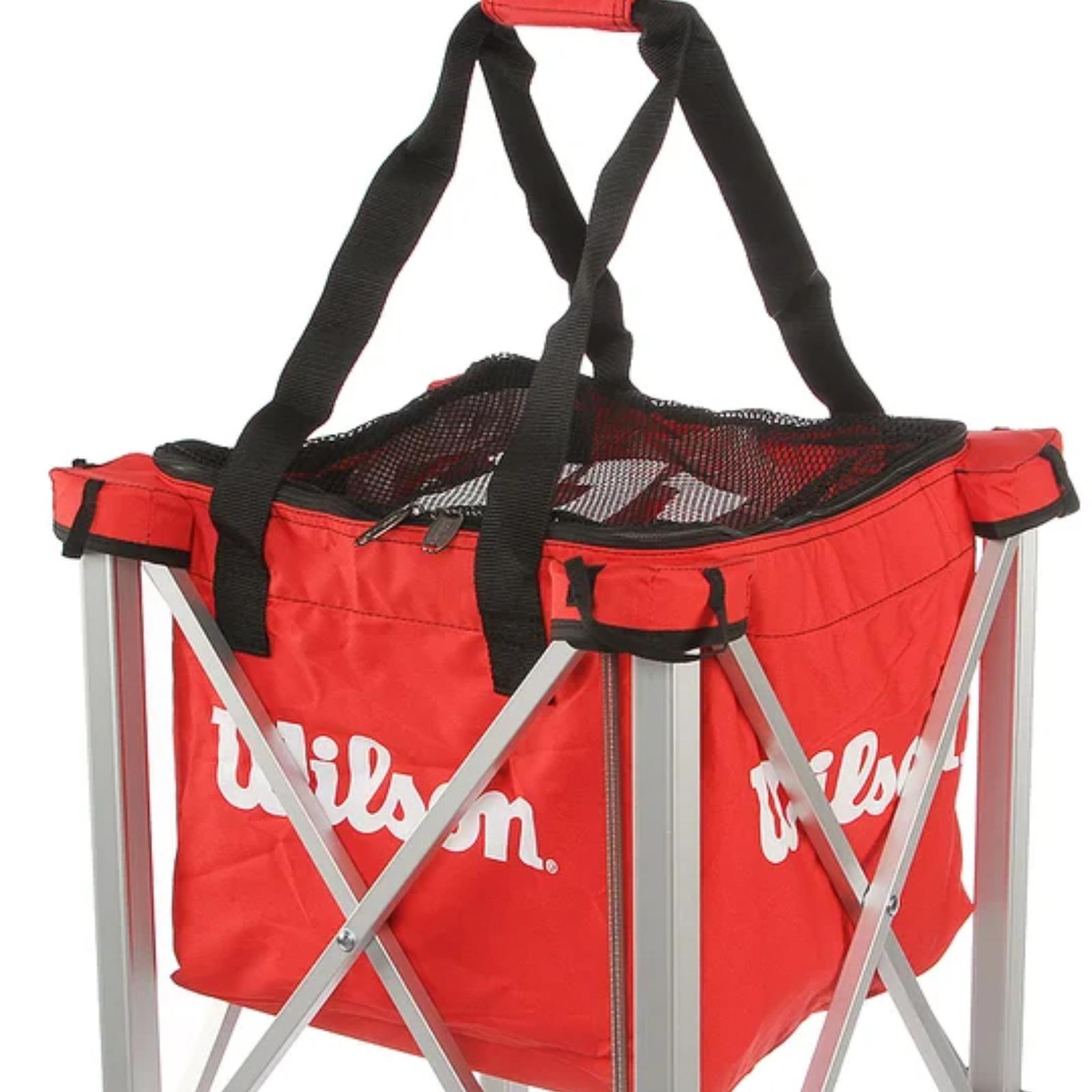 Red Wilson tennis teaching cart with a soft carrying case and silver retractable frame.